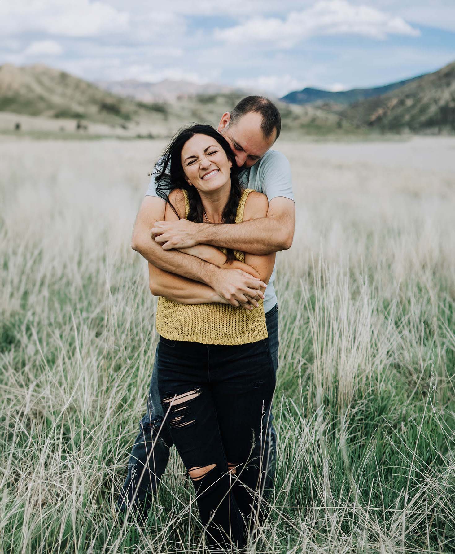 couple photos in a meadow